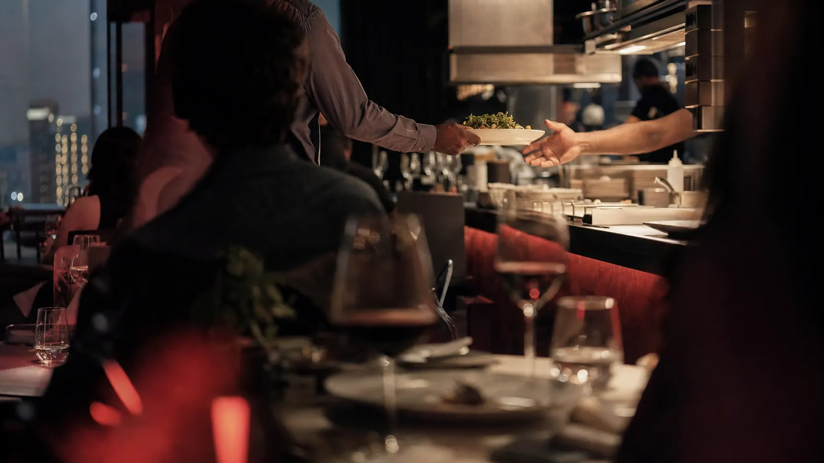 Conceptual editorial image of a restaurant team during service