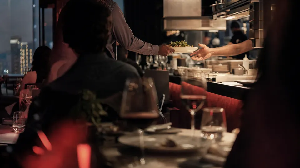 Conceptual editorial image of a restaurant team during service
