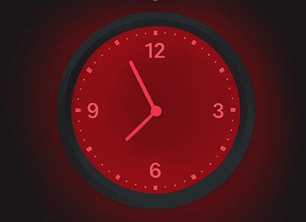 Red clock showing time at 11:55, symbolizing urgency and renewal.